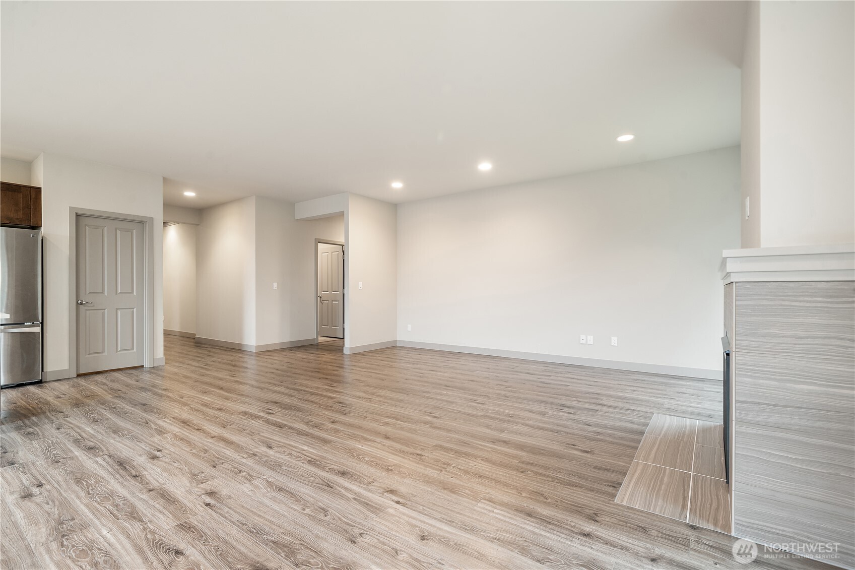 200 Blue Glacier Loop Sequim, WA 98382 - Photo 11 of 39 a view of an empty room with wooden floor