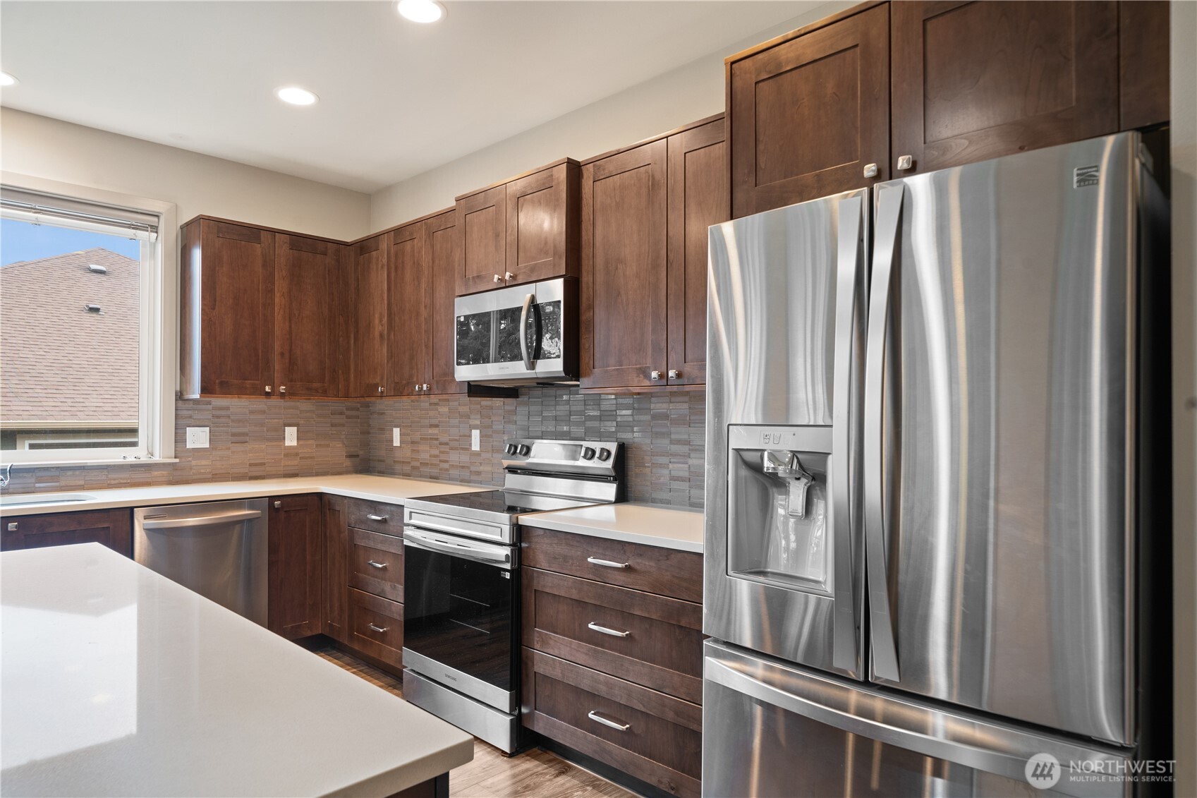200 Blue Glacier Loop Sequim, WA 98382 - Photo 19 of 39 a kitchen with a refrigerator sink and microwave
