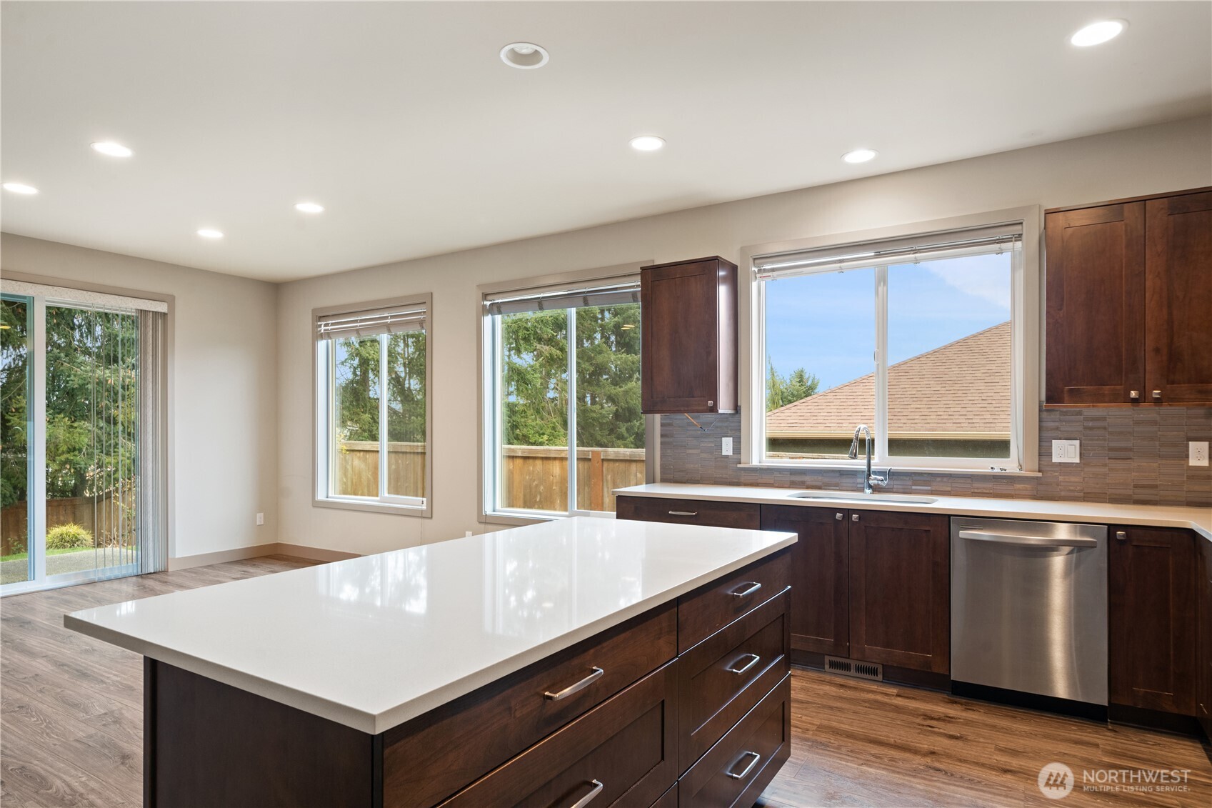 200 Blue Glacier Loop Sequim, WA 98382 - Photo 20 of 39 a kitchen with a sink stove and cabinets