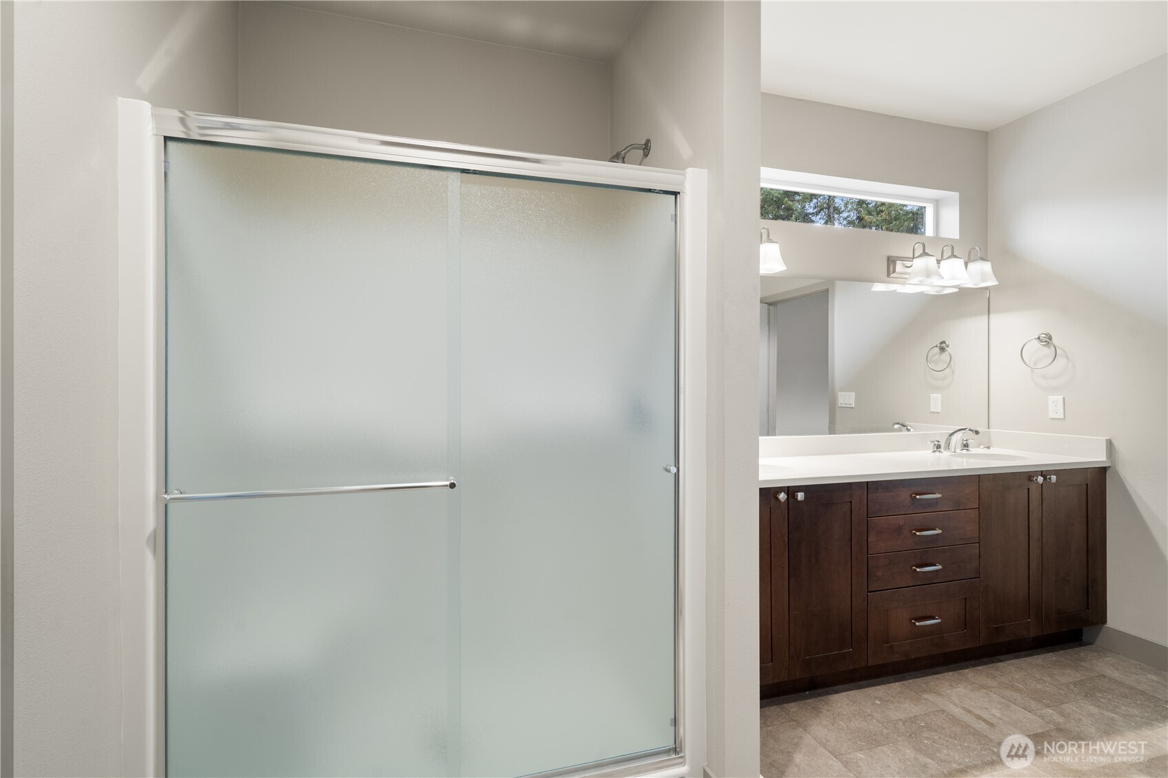 200 Blue Glacier Loop Sequim, WA 98382 - Photo 27 of 39 a bathroom with a shower sink vanity and mirror
