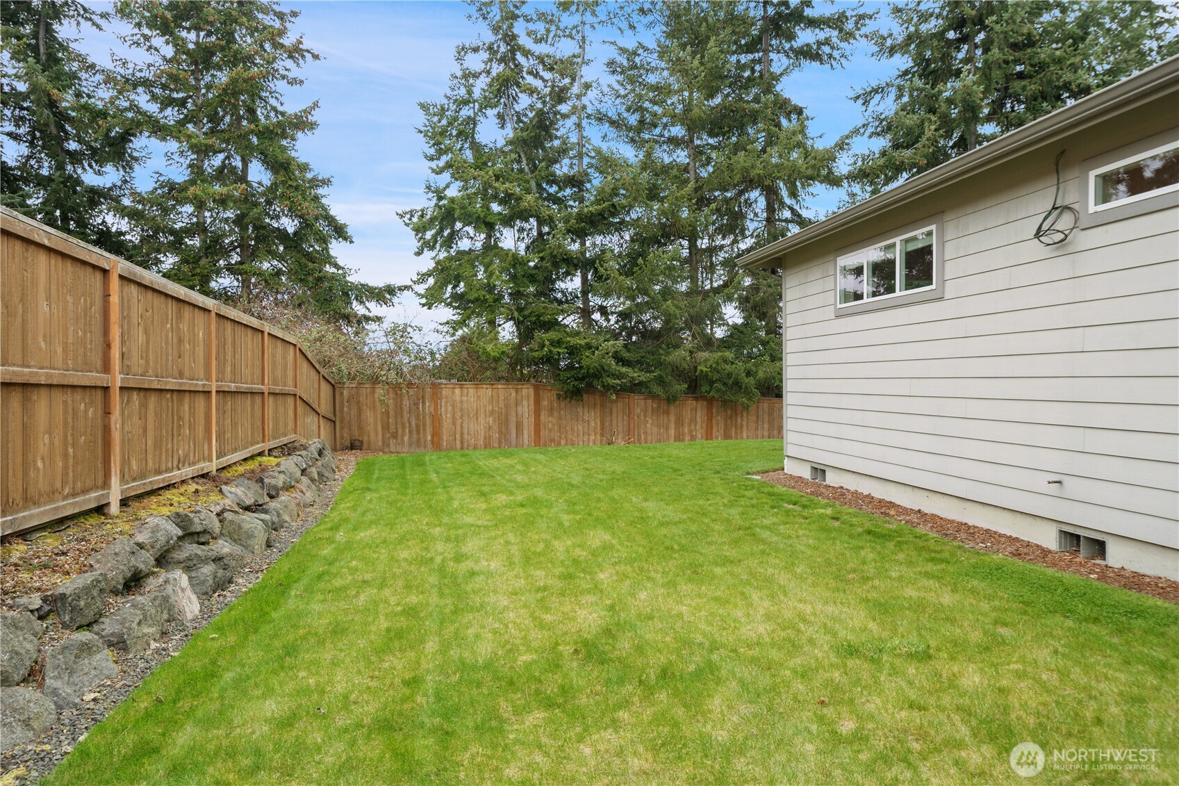 200 Blue Glacier Loop Sequim, WA 98382 - Photo 34 of 39 a backyard of a house with lots of green space