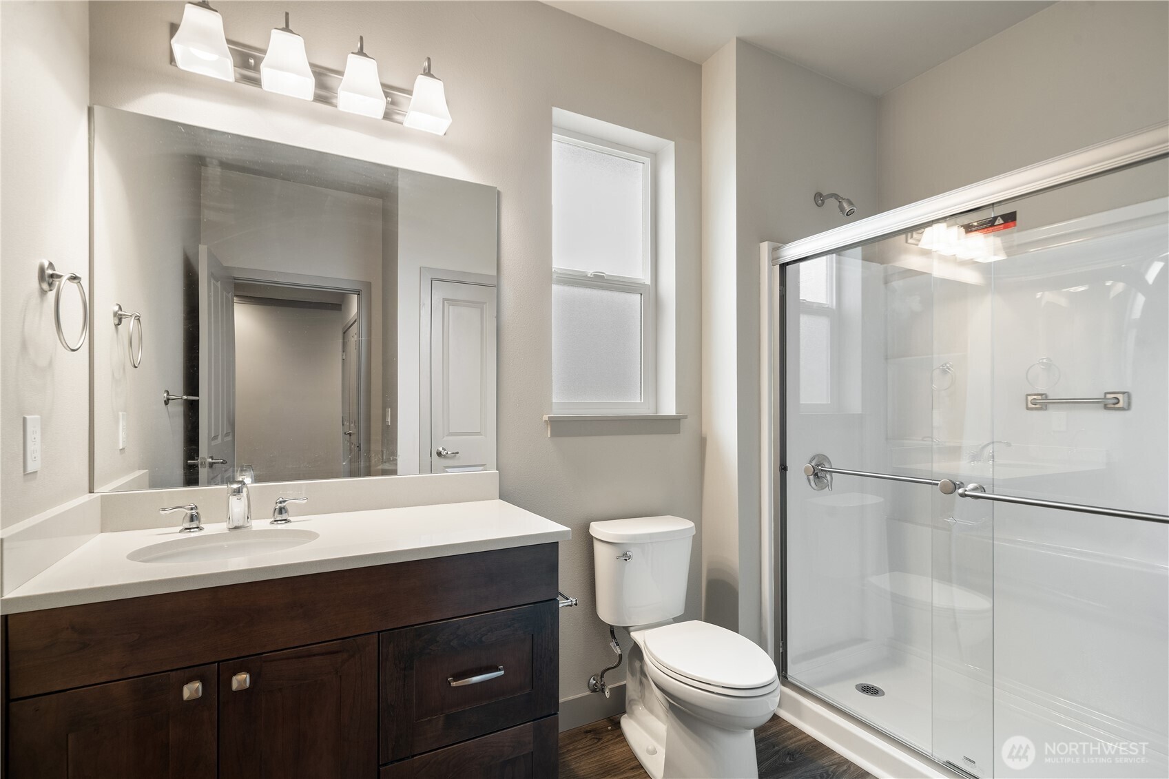 200 Blue Glacier Loop Sequim, WA 98382 - Photo 8 of 39 a bathroom with a sink toilet a mirror and shower