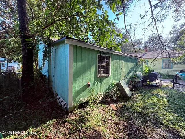 a backyard of a house with lots of green space