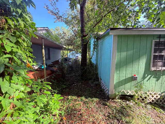 a backyard of a house with outdoor seating