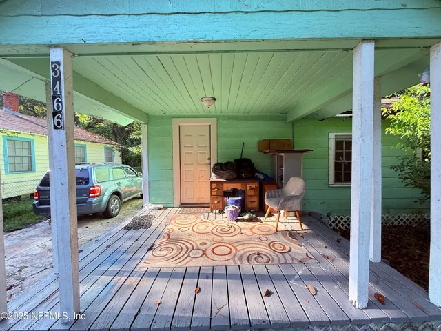 a view of a two chairs in the patio