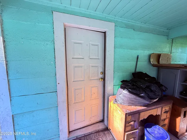 a kitchen with a refrigerator and a stove