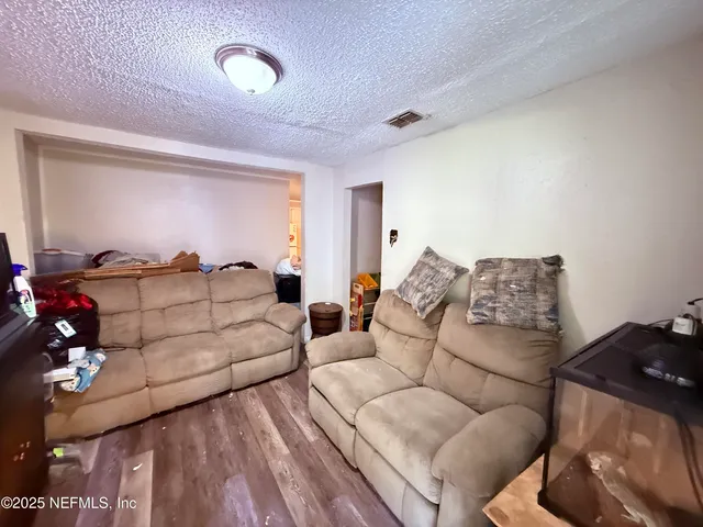 a living room with couches and furniture