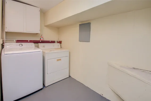a view of storage and utility room with washer and dryer