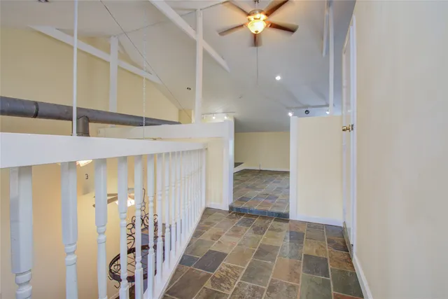 a view of a hallway with a chandelier