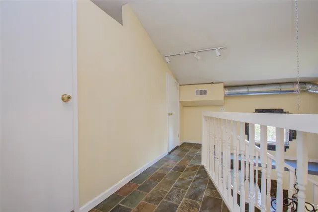 a view of a hallway with entryway