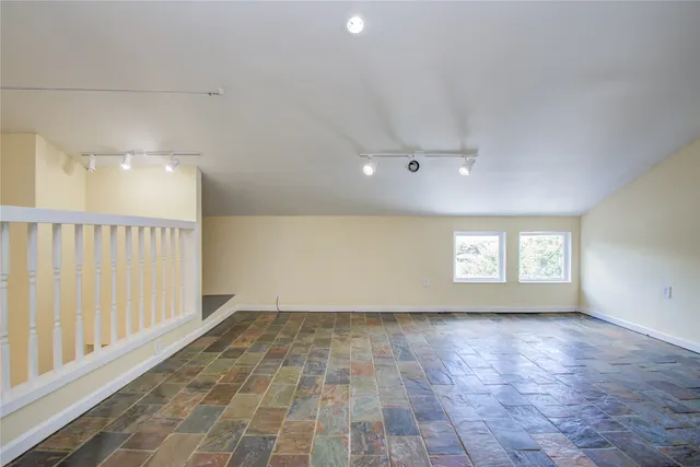 a view of an empty room and window