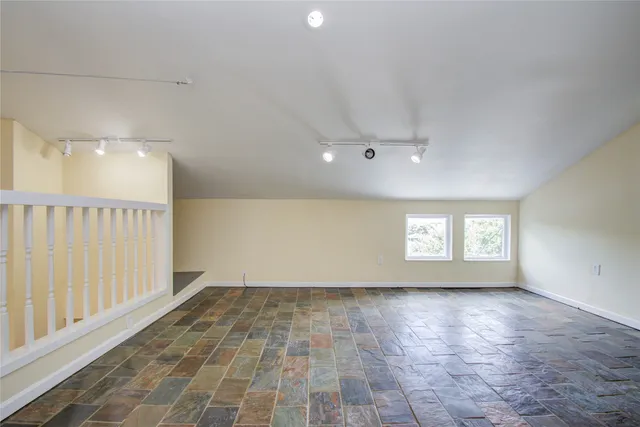 a view of an empty room and window