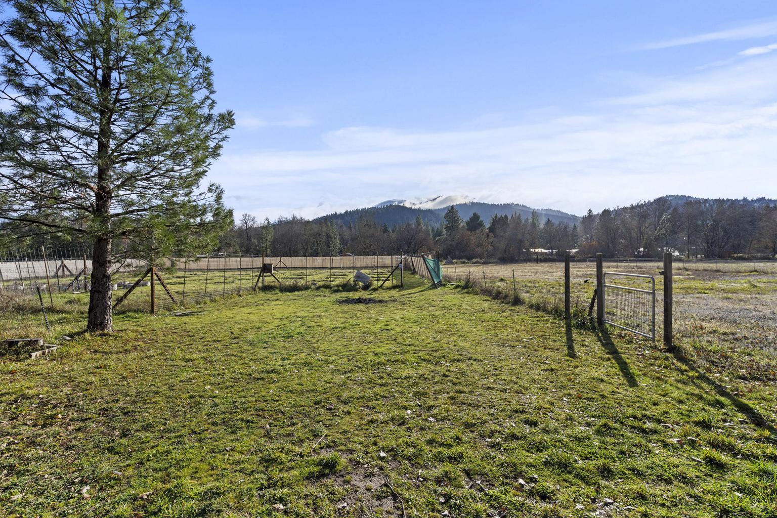 1190 Cedar Flat Road Williams, OR 97544 - Photo 27 of 45 a view of a lake with houses in the back