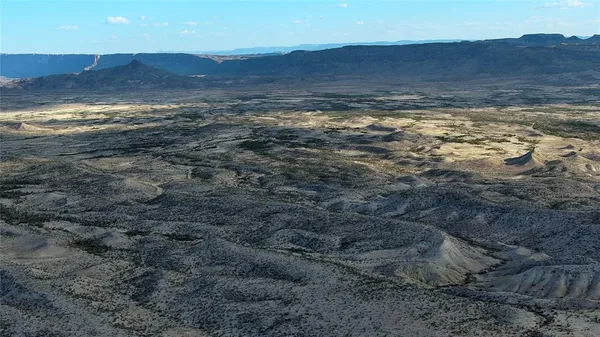a view of an ocean and a mountain