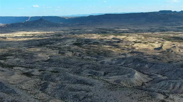a view of an ocean and a mountain