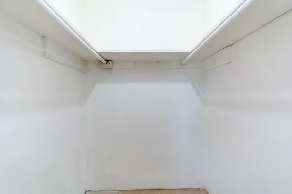 a view of an empty walk in closet