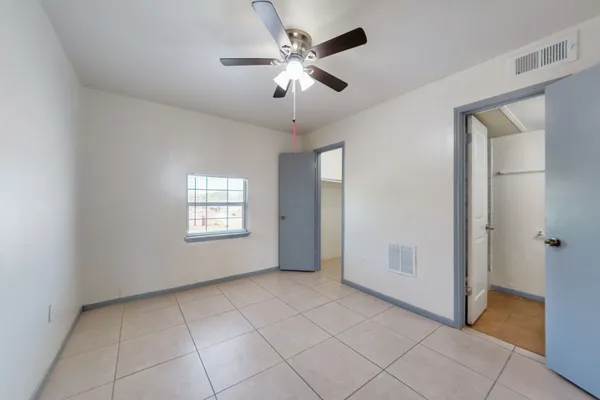 a view of an empty room with a window