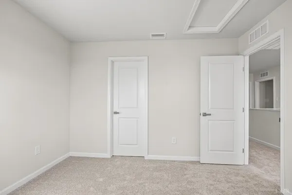 a bathroom with a toilet sink vanity tub and mirror