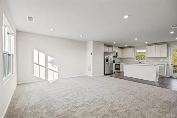 a view of a kitchen with a sink and cabinets