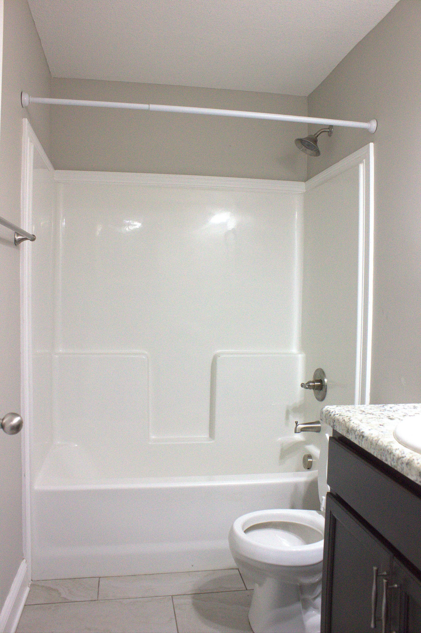 119 Ambridge Street Oak Grove, KY 42262 - Photo 13 of 19 a bathroom with a granite countertop bathtub shower sink vanity and toilet