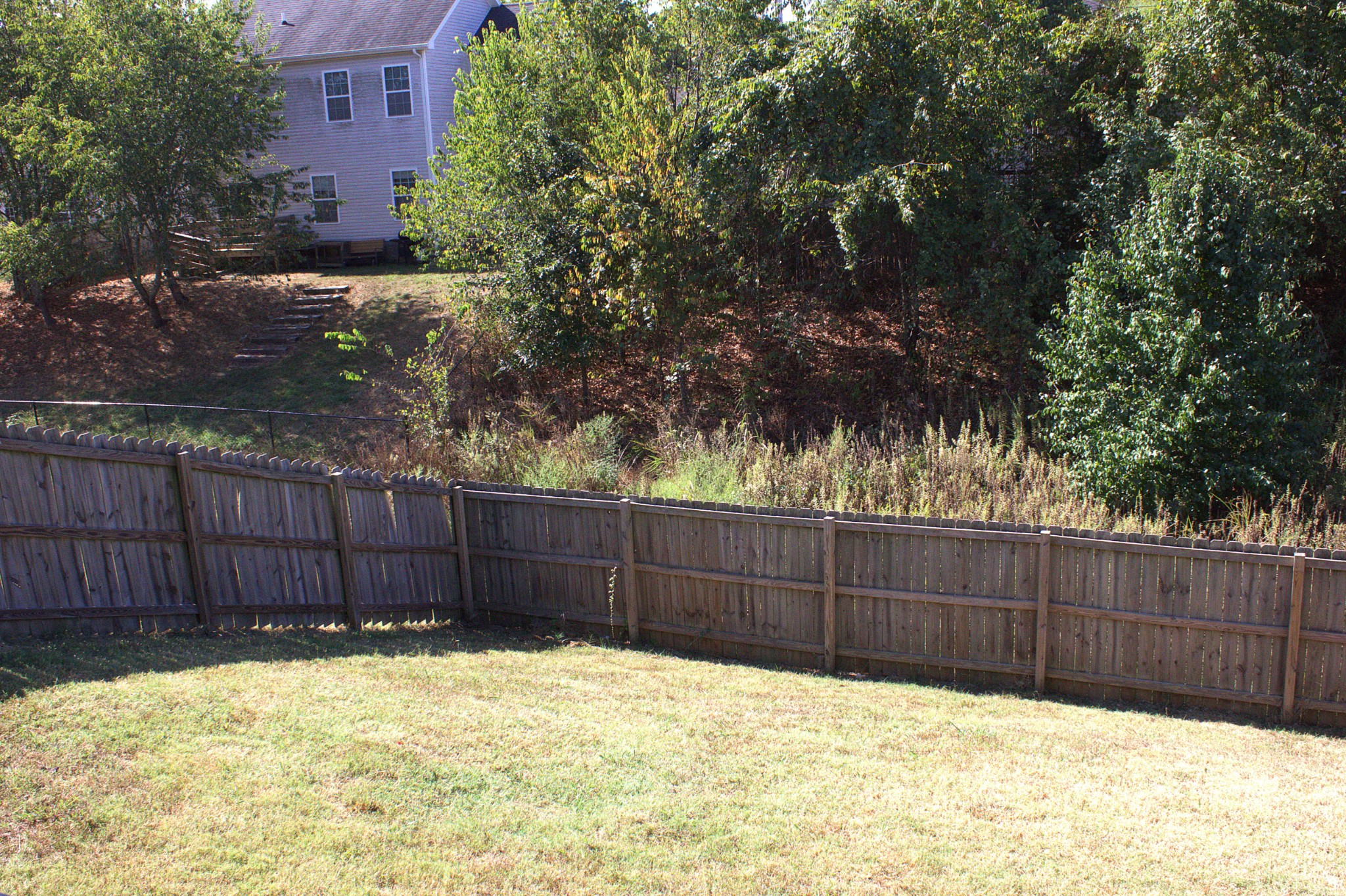 119 Ambridge Street Oak Grove, KY 42262 - Photo 18 of 19 a view of backyard with wooden fence