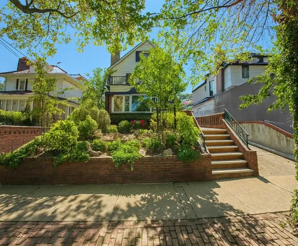 a view of a garden with flowers and plants