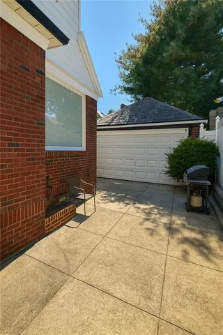 a view of balcony with wooden floor and fence