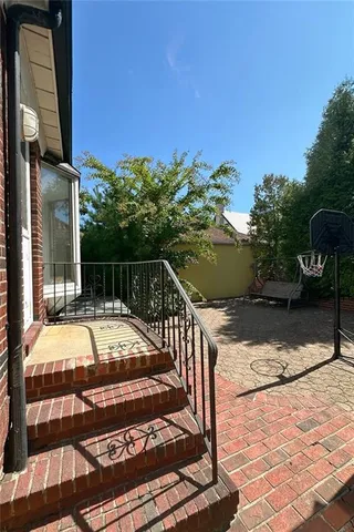 a view of a backyard with sitting area
