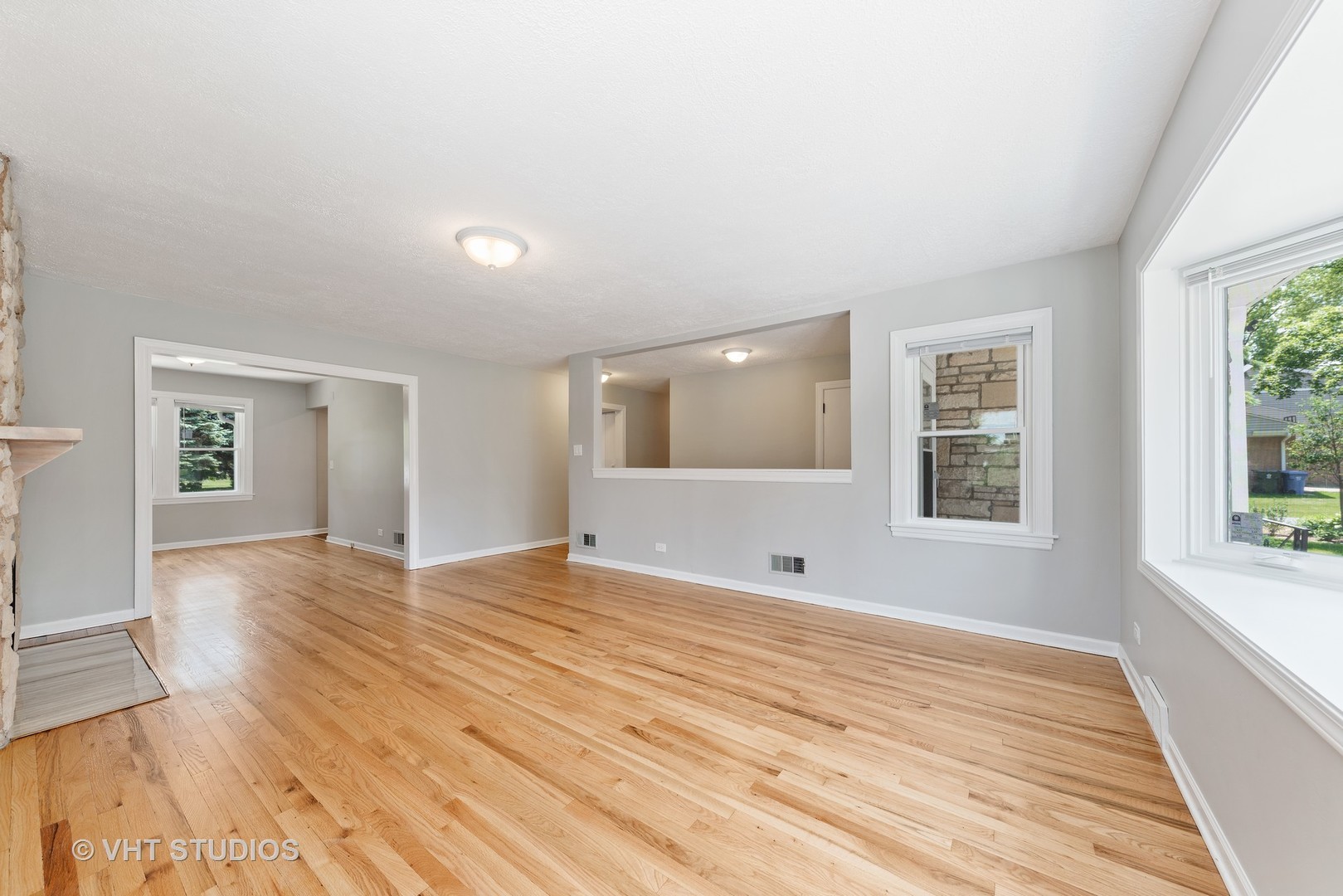 307 North Westgate Road Mount Prospect, IL 60056 - Photo 8 of 17 a view of an empty room with wooden floor and a window