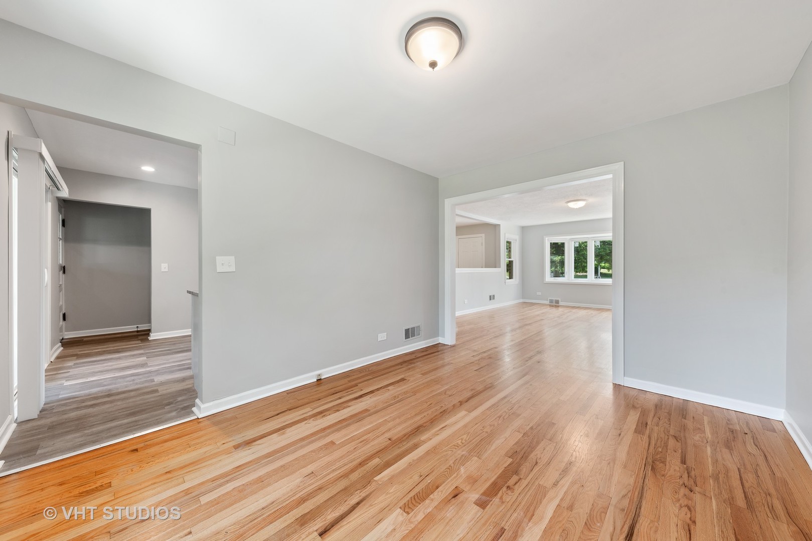 307 North Westgate Road Mount Prospect, IL 60056 - Photo 9 of 17 wooden floor in an empty room with a window