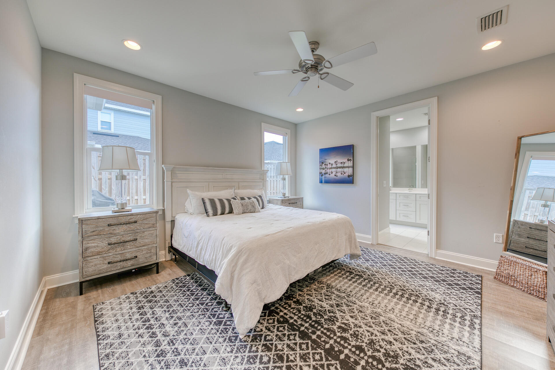 103 Chapman Street Santa Rosa Beach, FL 32459 - Photo 11 of 29 a bedroom with a bed and a mirror