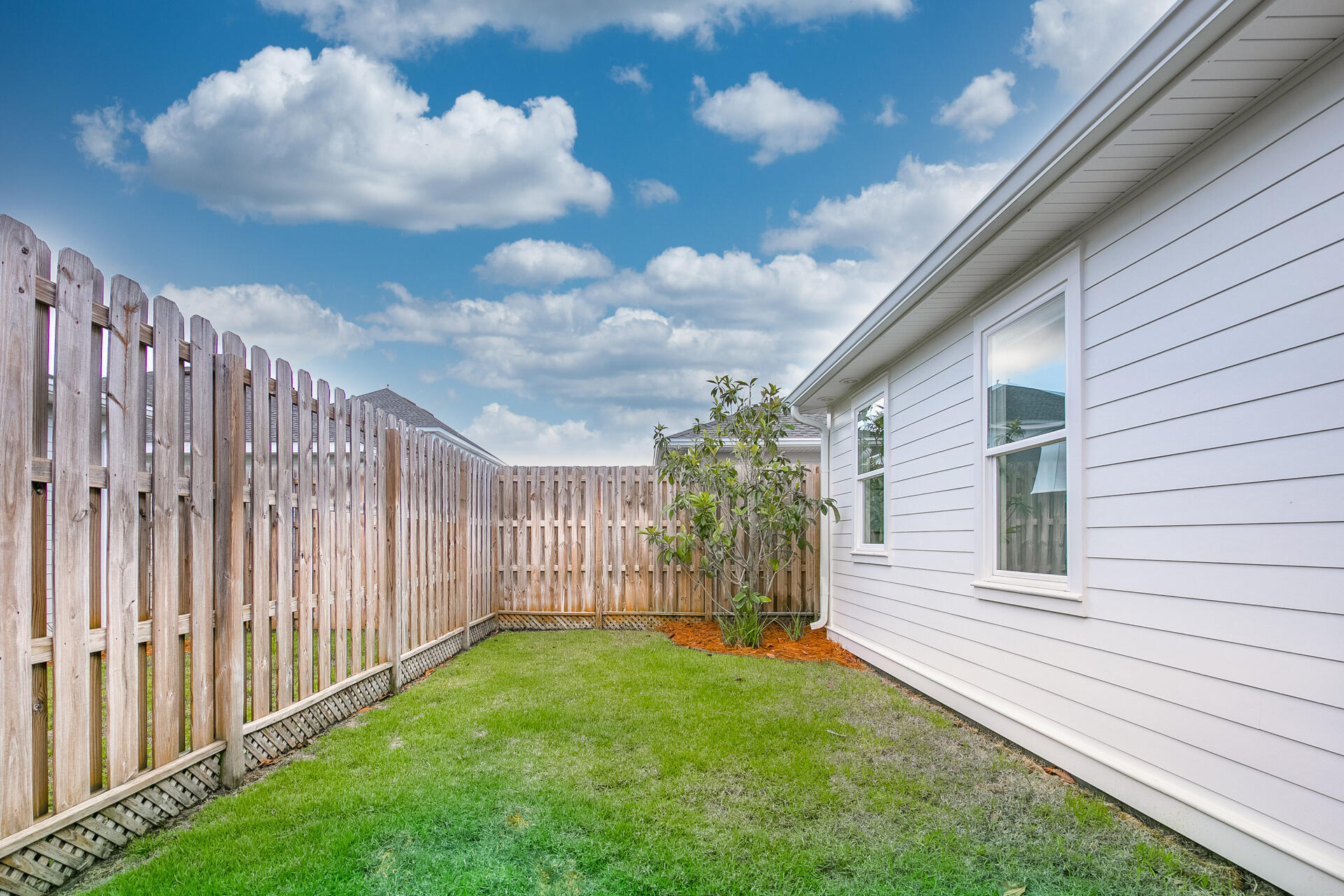 103 Chapman Street Santa Rosa Beach, FL 32459 - Photo 18 of 29 a view of a backyard with pathway