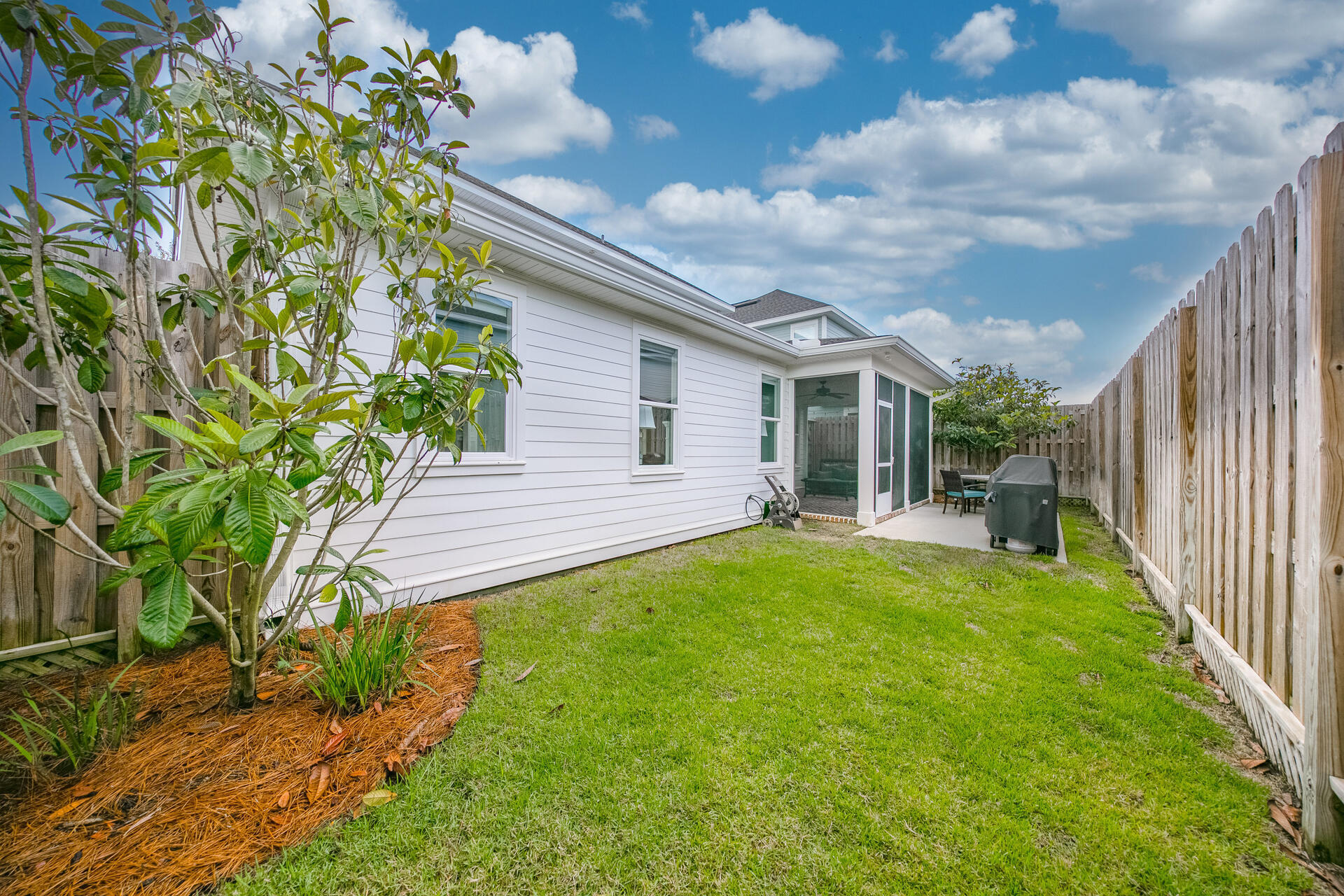 103 Chapman Street Santa Rosa Beach, FL 32459 - Photo 19 of 29 a view of a house with backyard and porch