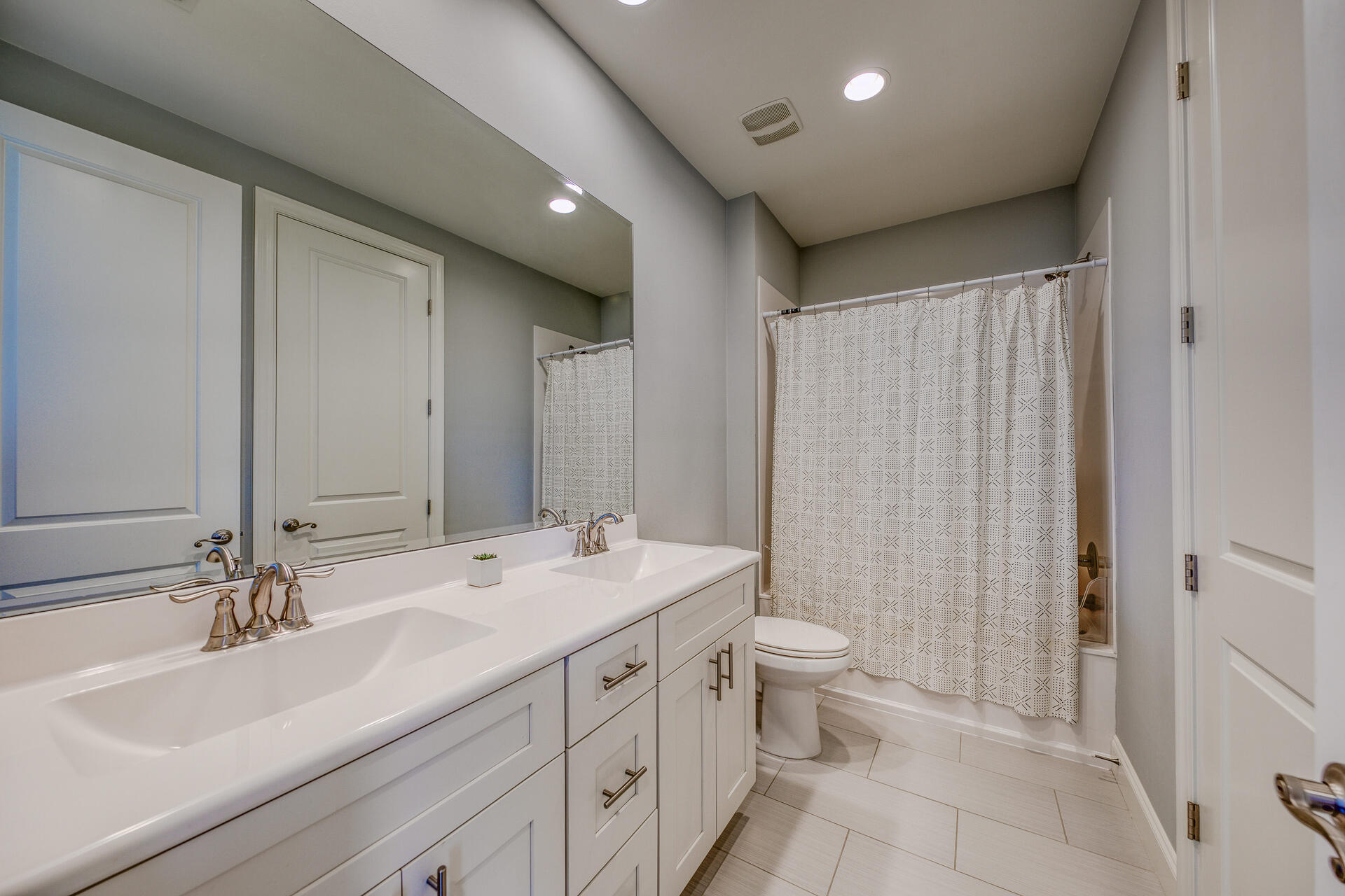 103 Chapman Street Santa Rosa Beach, FL 32459 - Photo 25 of 29 a bathroom with a double vanity sink mirror and toilet