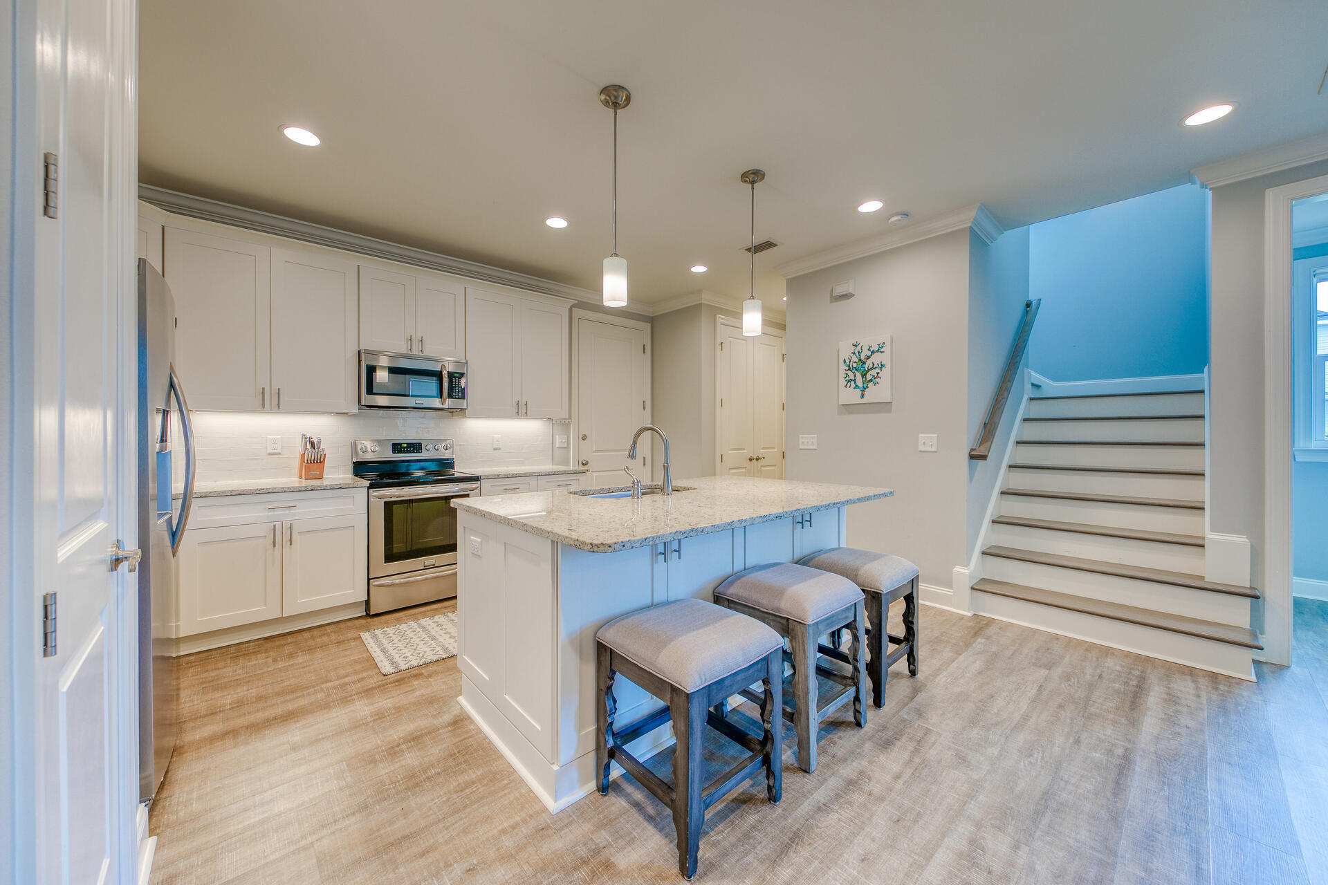103 Chapman Street Santa Rosa Beach, FL 32459 - Photo 7 of 29 a kitchen with sink refrigerator and microwave