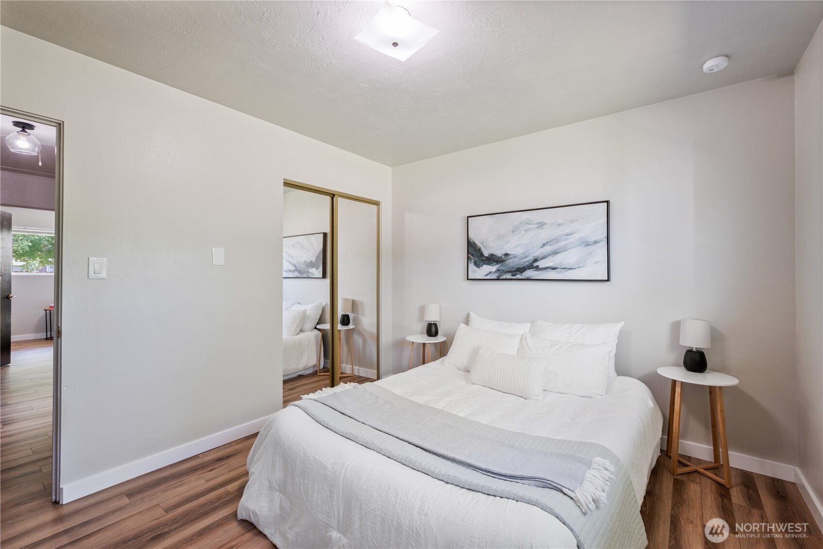 2943 Magnolia Street Longview, WA 98632 - Photo 17 of 36 a bedroom with a bed and a painting on the wall