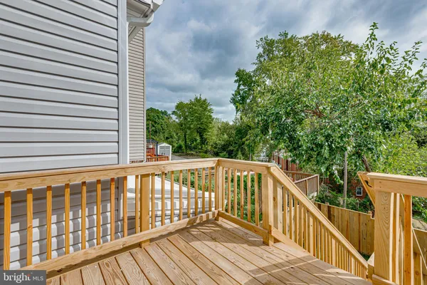 a view of balcony with wooden floor