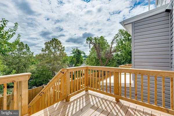 a view of a balcony with trees