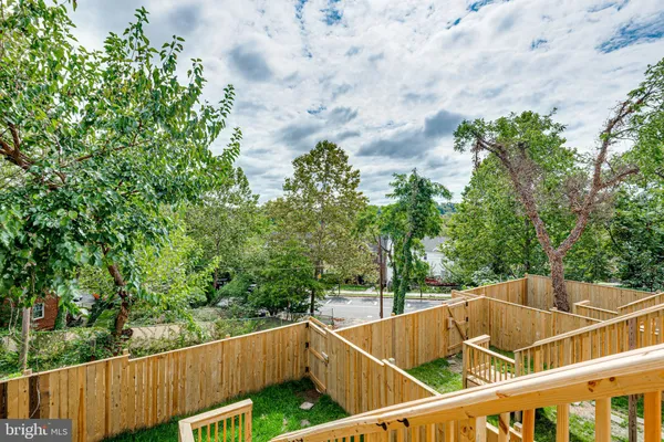 a view of a balcony with yard