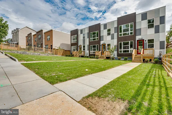 a view of a building with a yard