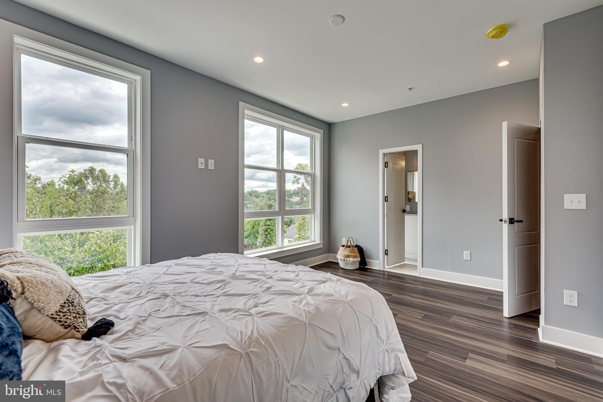 3830 First Street Southeast Washington, DC 20032 - Photo 22 of 49 a spacious bedroom with a large bed and a window