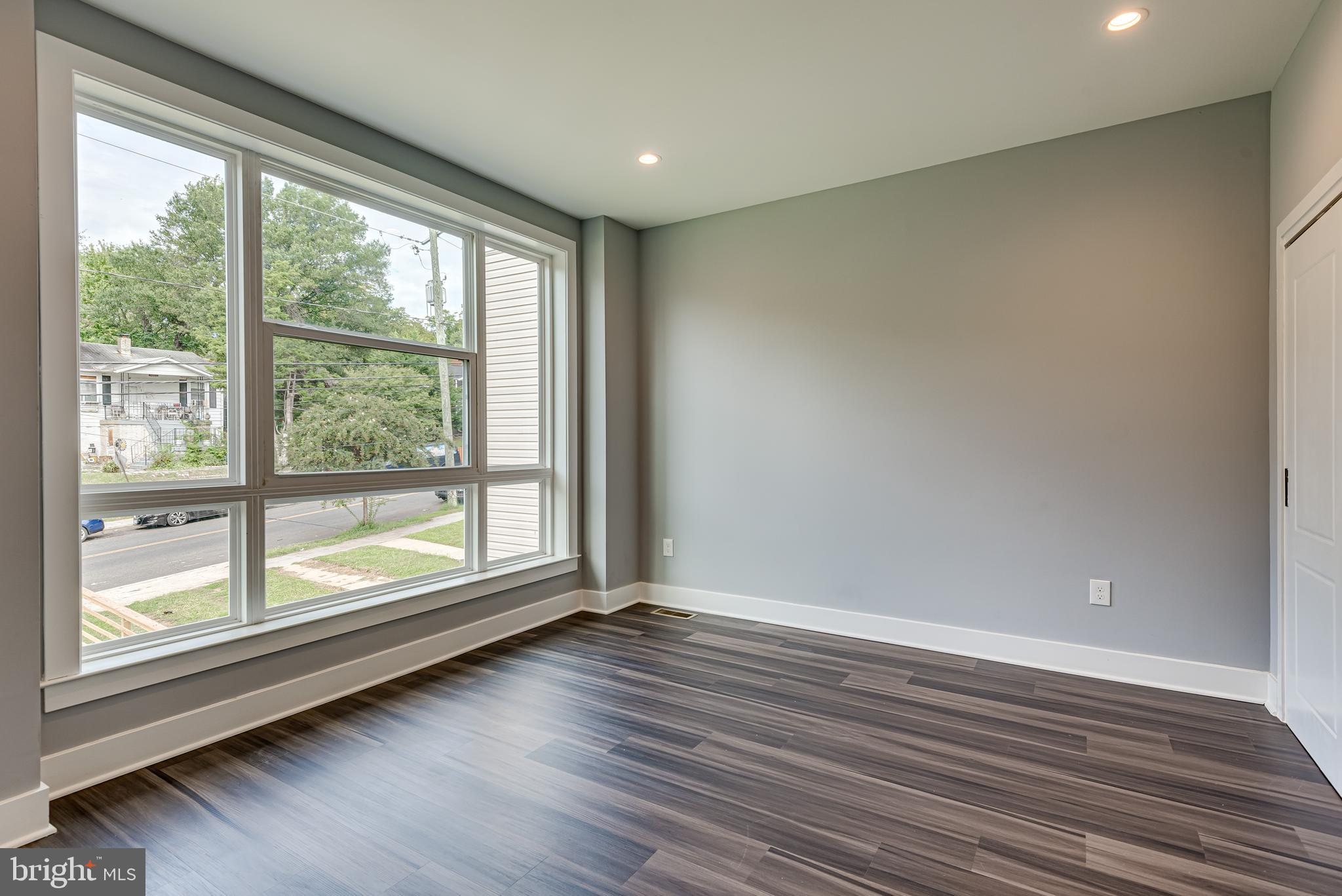 3830 First Street Southeast Washington, DC 20032 - Photo 29 of 49 a view of room with window and wooden floor