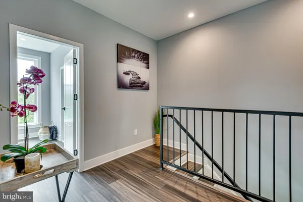 a view of a hallway and wooden floor