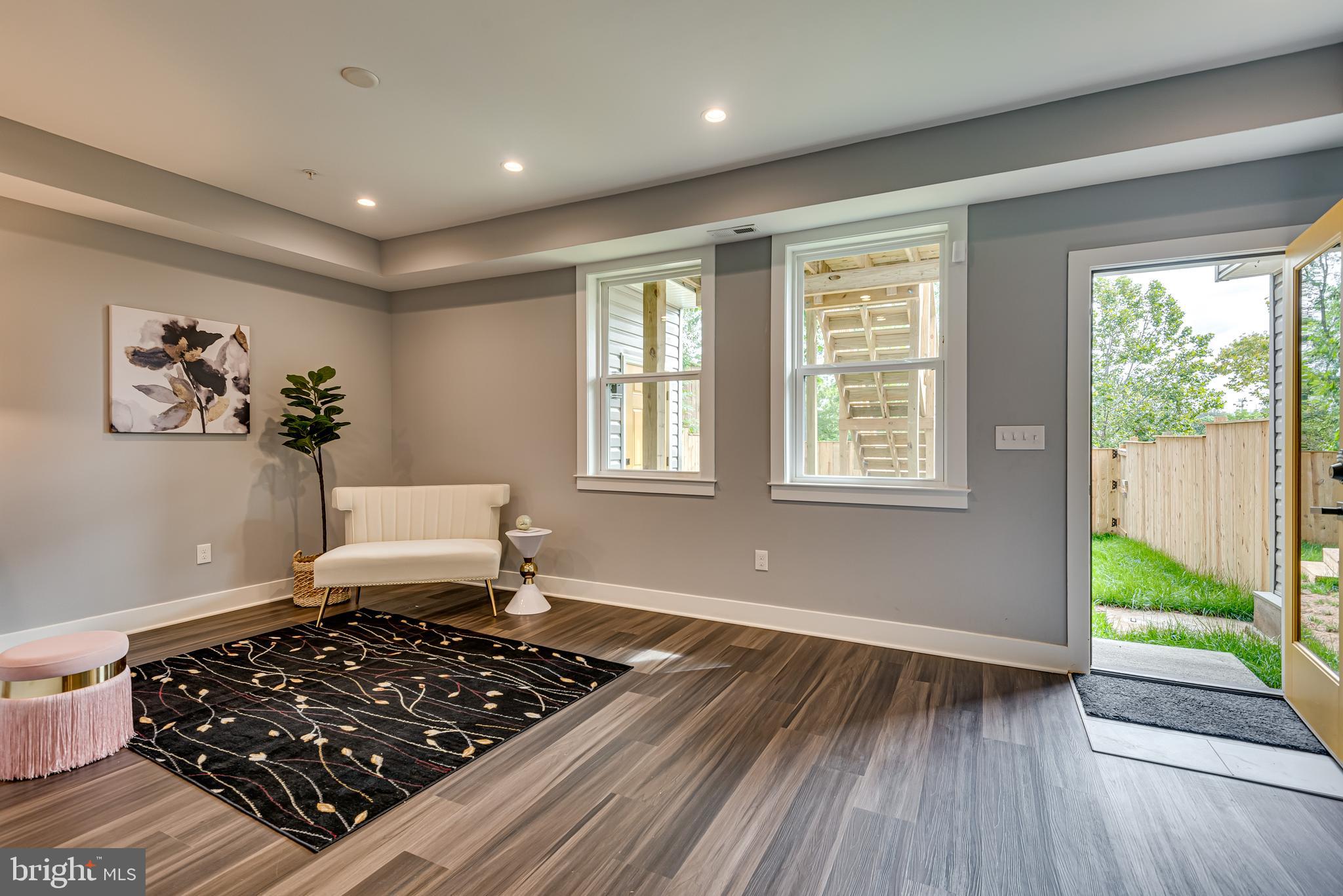 3830 First Street Southeast Washington, DC 20032 - Photo 34 of 49 a living room with wooden floor and a window