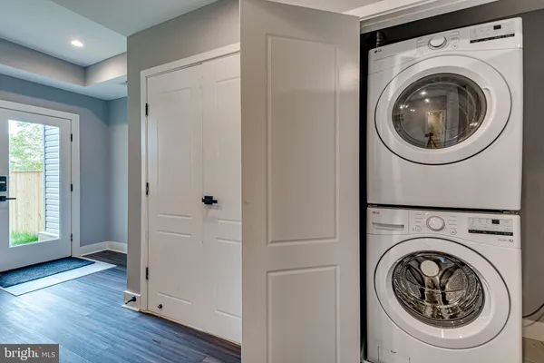 a view of a hallway with washer and dryer