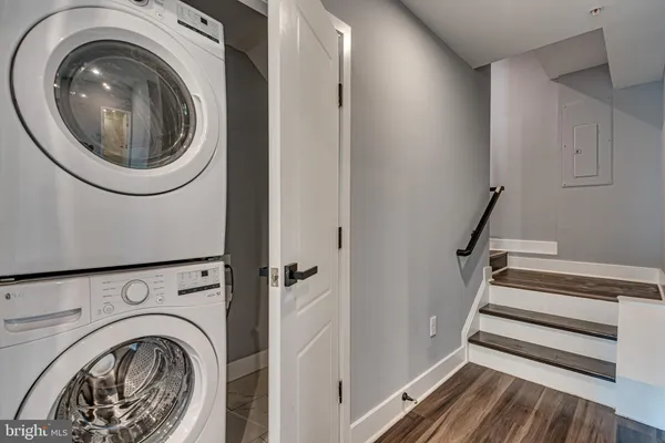 a view of a hallway with washer and dryer