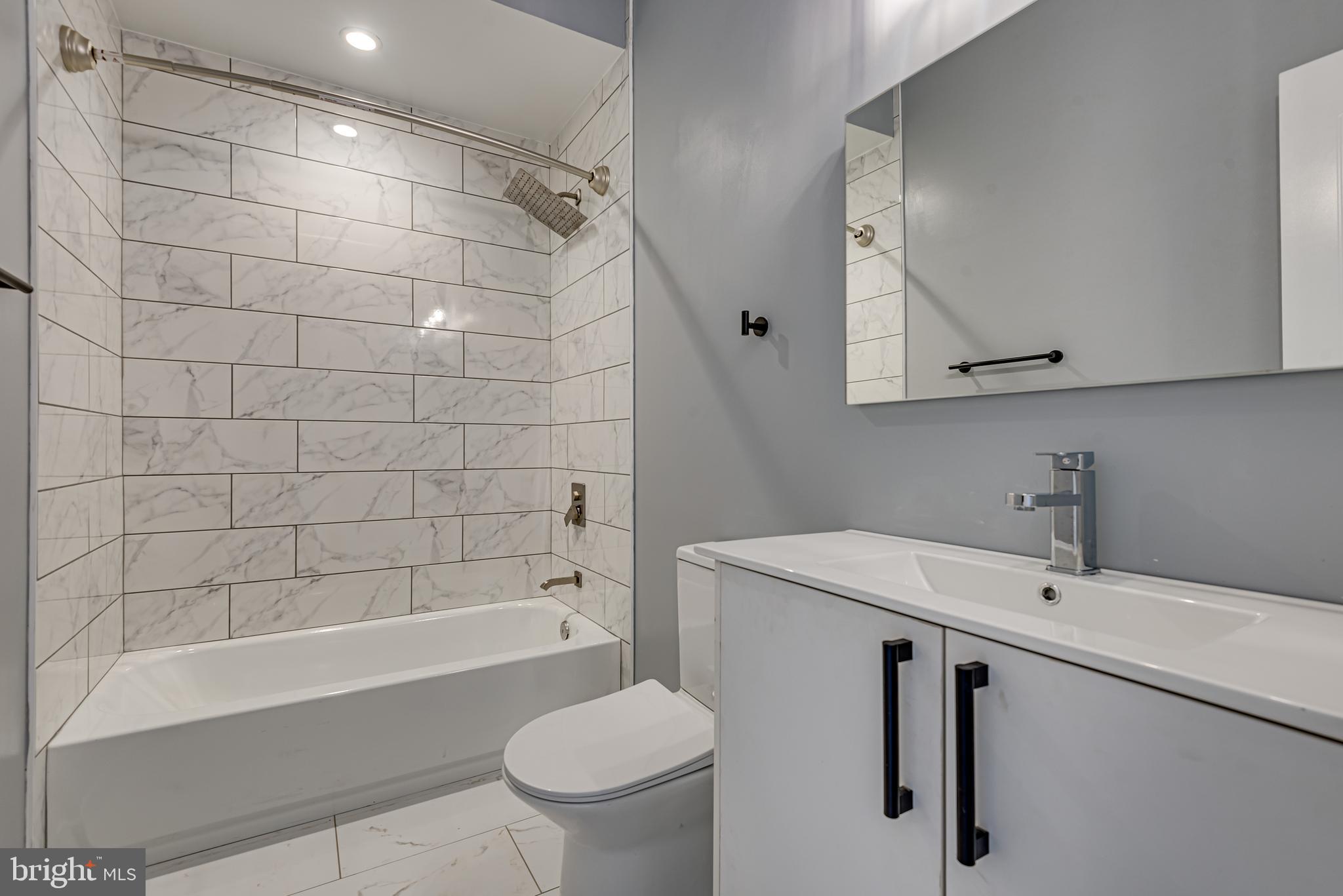 3830 First Street Southeast Washington, DC 20032 - Photo 41 of 49 a bathroom with a sink toilet and shower