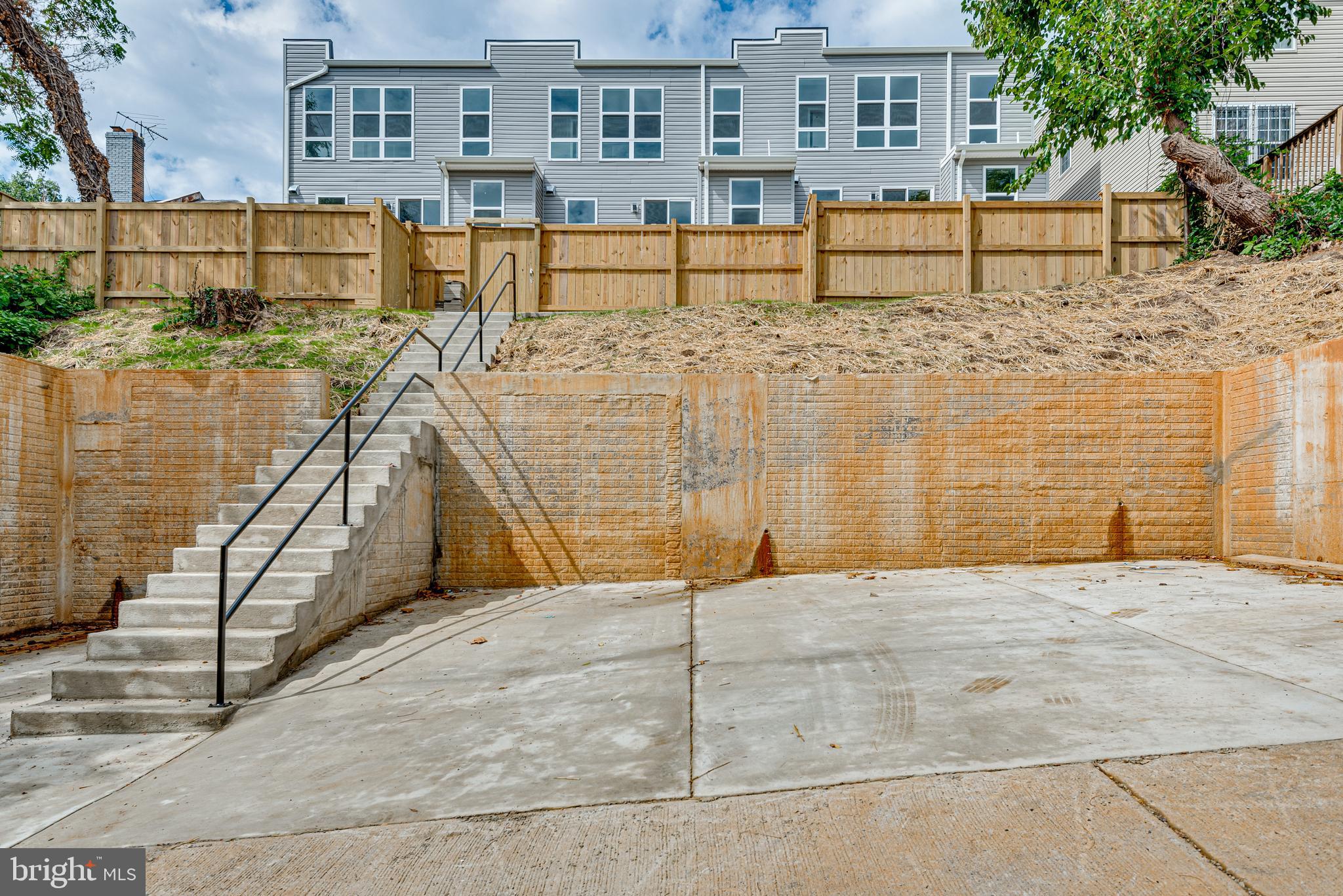 3830 First Street Southeast Washington, DC 20032 - Photo 47 of 49 a view of a brick house with large windows