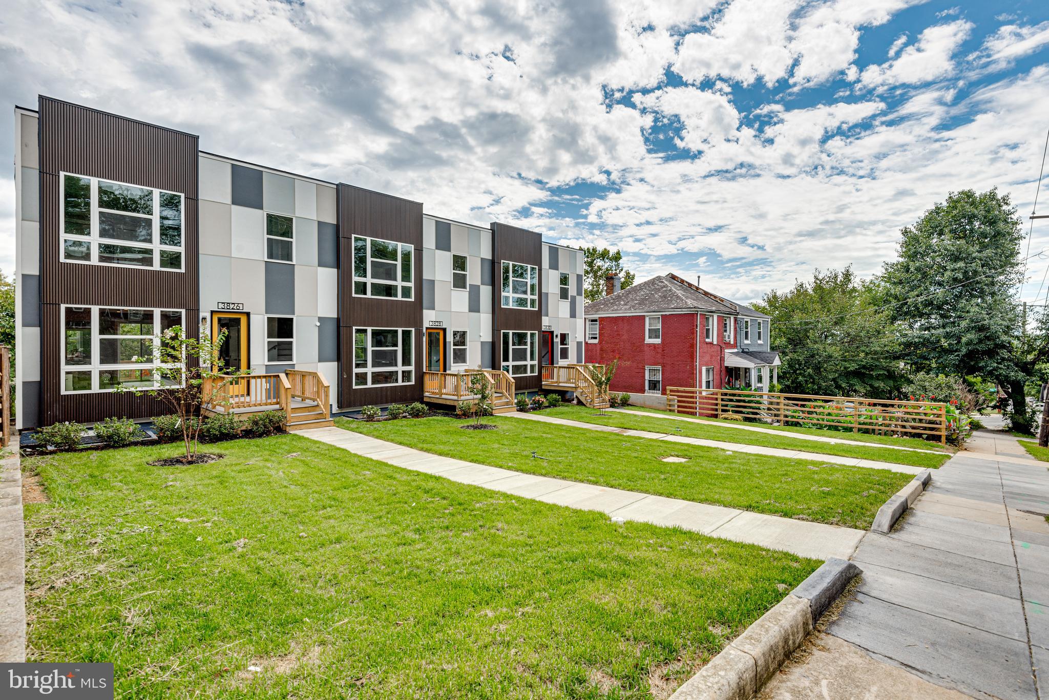 3830 First Street Southeast Washington, DC 20032 - Photo 5 of 49 a view of a house with a big yard and large trees