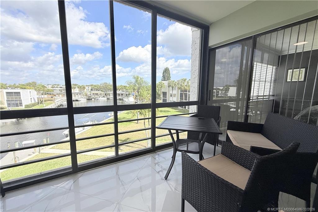 1950 Southwest Palm City Road, Unit 3309 Stuart, FL 34994 - Photo 14 of 32 a view of a livingroom with furniture and a window